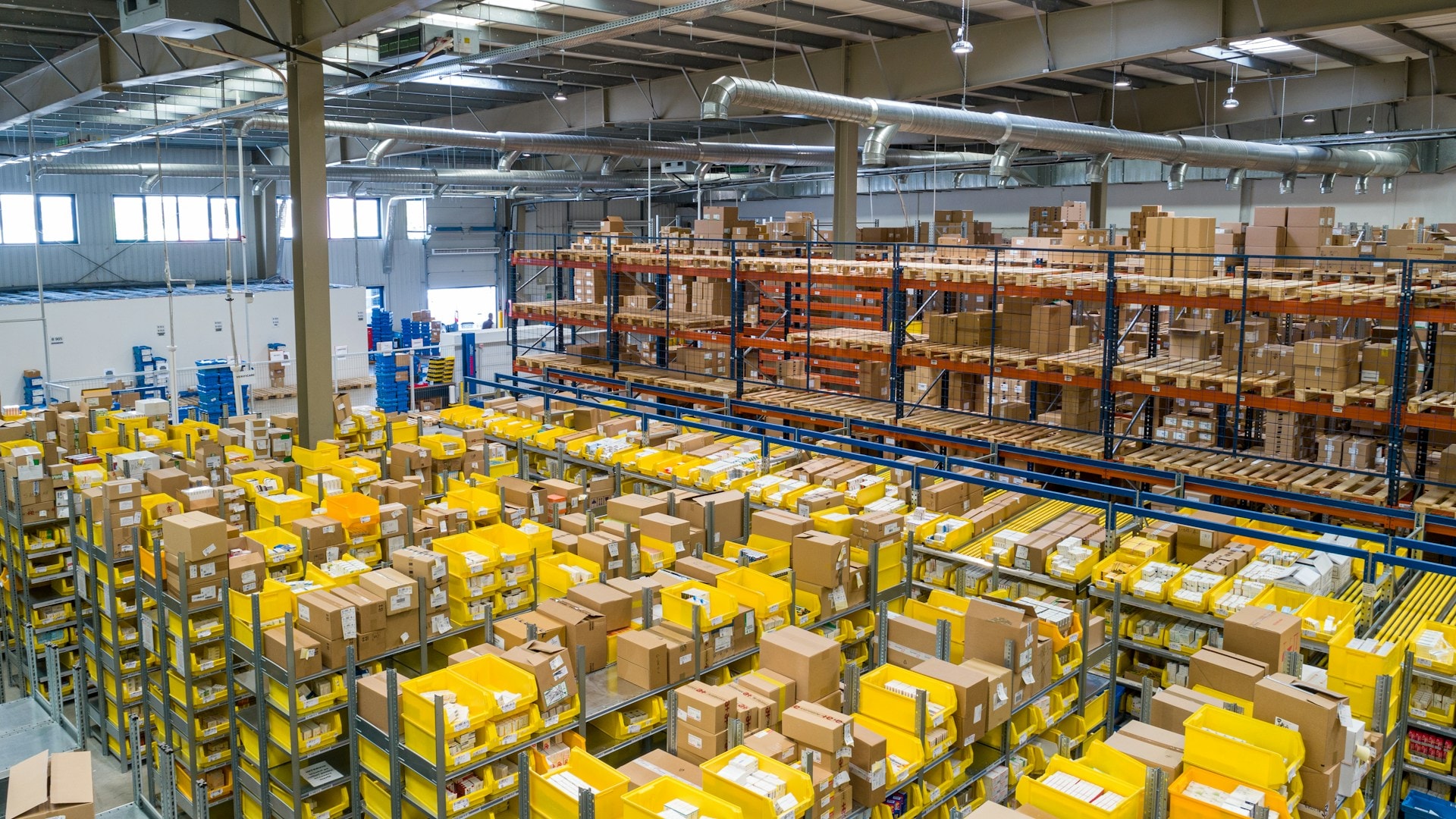 Large industrial warehouse with pallet racks and stored goods